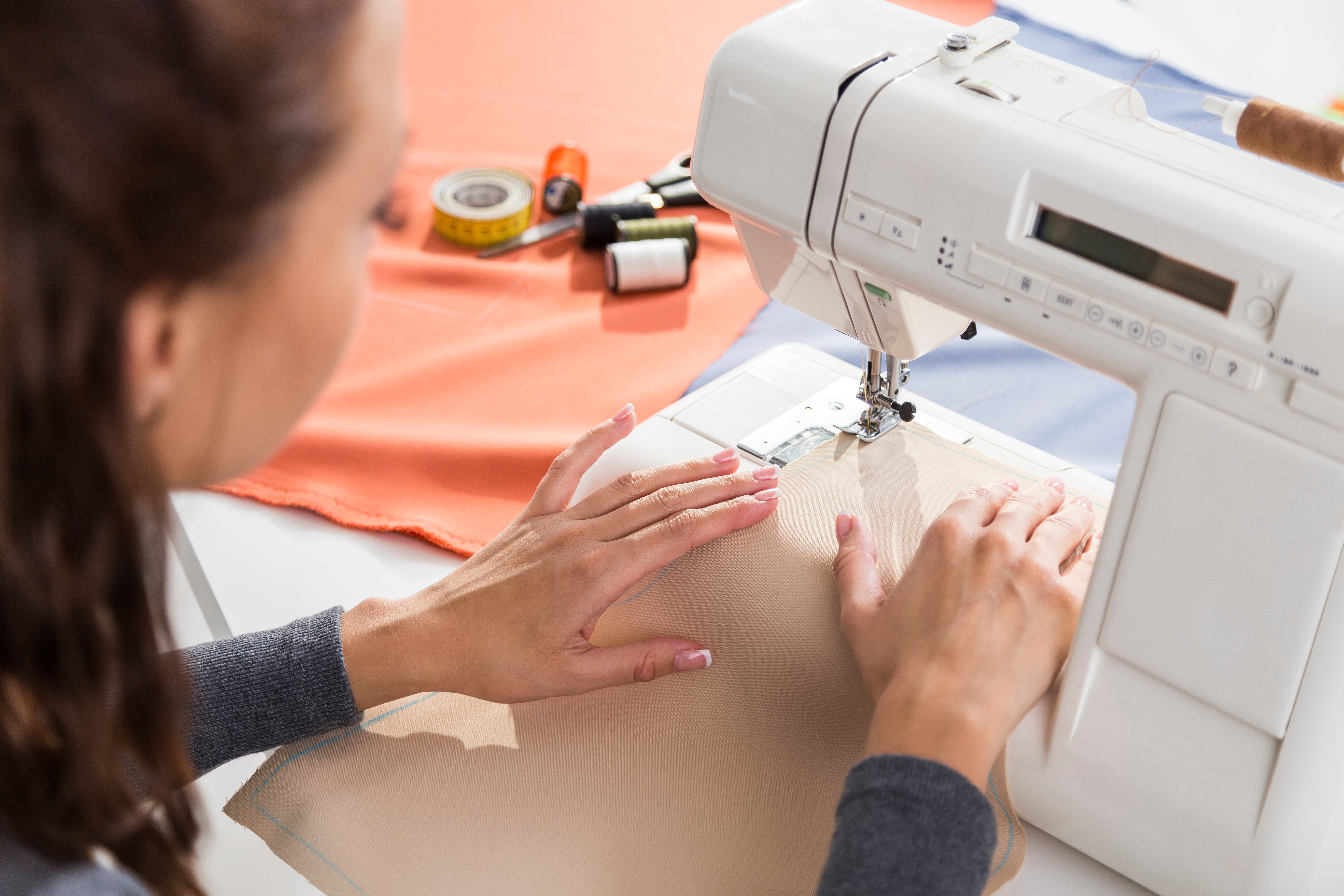 Picture women using sewing machine